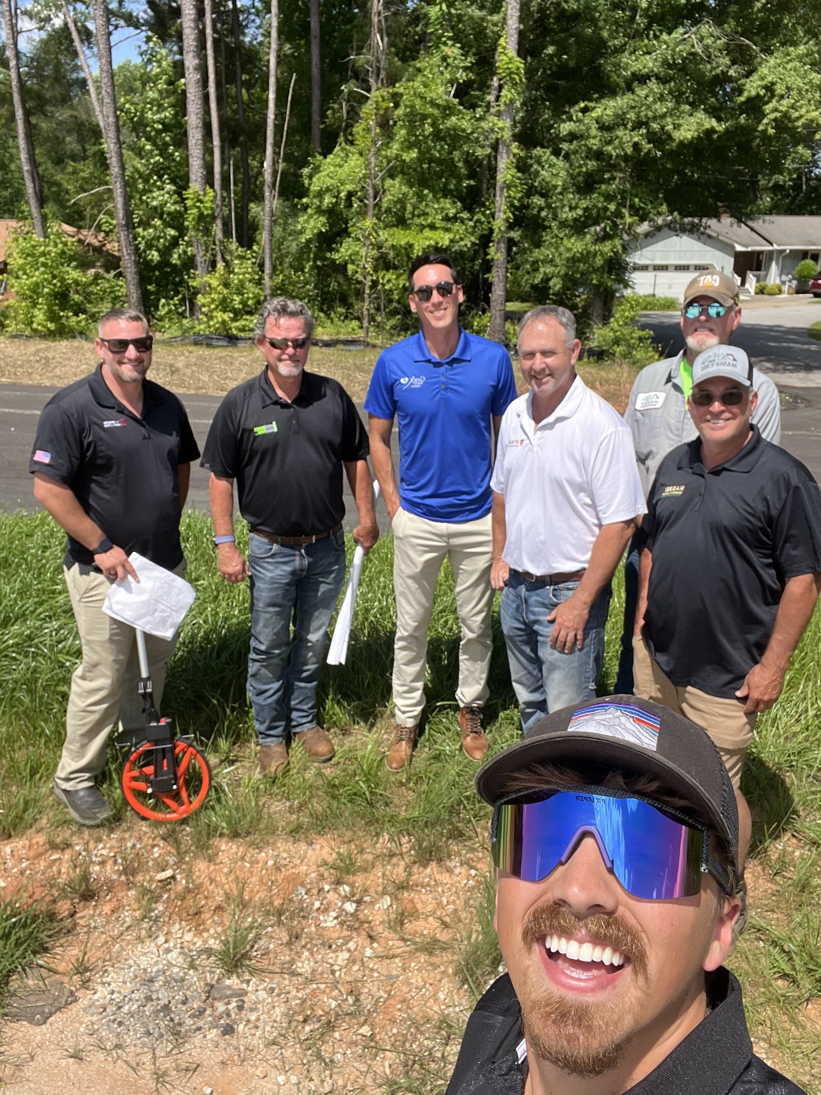 Brayden with the team at a pre-construction site walk