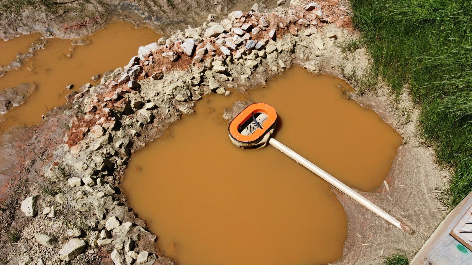Rymar Marlee Float skimmer working in a retention pond on our Seneca site